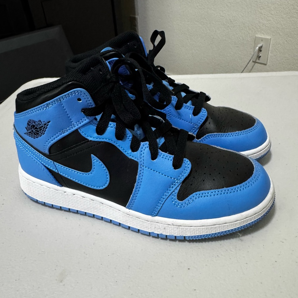 Air Jordan 1 Mid GS (Grade School) in University Blue, Black, and White